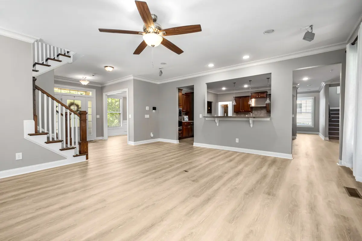 Light luxury vinyl plank across an open-plan living area